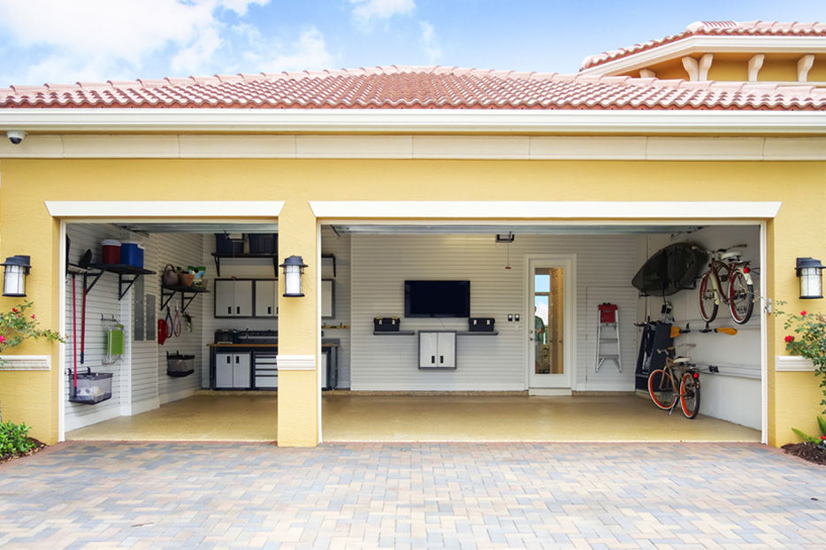 A well-organized garage in a yellow-painted house.
